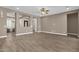 Open-concept living area featuring tile floors and neutral color palette creating a calming atmosphere at 10350 E Texas Ave, Mesa, AZ 85212