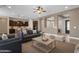 Spacious open-concept living room with ample seating and view into the kitchen at 10350 E Texas Ave, Mesa, AZ 85212