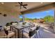 Covered outdoor dining area perfect for entertaining, with views of the backyard at 10350 E Texas Ave, Mesa, AZ 85212