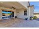Covered patio with tile flooring and views of the landscaped backyard at 10350 E Texas Ave, Mesa, AZ 85212