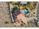 Breathtaking aerial view of the home's backyard oasis featuring a private pool, a gazebo, and meticulously kept landscaping at 1234 E Claire Dr, Phoenix, AZ 85022