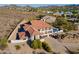Two-story home showcasing desert landscaping with a pool, outdoor living spaces, and mountain views in the background at 1234 E Claire Dr, Phoenix, AZ 85022
