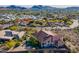 Sprawling home surrounded by desert landscaping, mature trees, and beautiful mountain views in the distance at 1234 E Claire Dr, Phoenix, AZ 85022