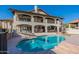Beautiful backyard showcasing a pool, patio seating, and upper-level balconies for relaxed outdoor living at 1234 E Claire Dr, Phoenix, AZ 85022