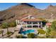 Stunning backyard featuring a refreshing pool, covered patio, desert views and an outdoor basketball court at 1234 E Claire Dr, Phoenix, AZ 85022
