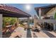 Outdoor living with a pool, covered patio, and spiral staircase for an elevated lifestyle and outdoor enjoyment at 1234 E Claire Dr, Phoenix, AZ 85022