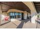 Spacious covered balcony featuring stone columns and comfortable seating at 1234 E Claire Dr, Phoenix, AZ 85022