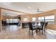 Dining room with a glass table, modern lighting, and scenic views at 1234 E Claire Dr, Phoenix, AZ 85022