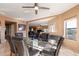 Open dining area with a glass table, modern finishes, and natural light at 1234 E Claire Dr, Phoenix, AZ 85022