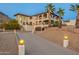 Elegant home featuring a long driveway, two stories, a mountain view, and desert landscaping at 1234 E Claire Dr, Phoenix, AZ 85022