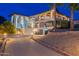 Luxury two-story home featuring a spacious driveway, multi-level balconies, and decorative columns at 1234 E Claire Dr, Phoenix, AZ 85022