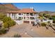 Stunning two-story home boasting a Spanish tile roof, balconies, garages, and a pool with a cabana at 1234 E Claire Dr, Phoenix, AZ 85022