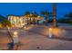 Exterior elevation of an estate home with a long driveway and desert landscaping at 1234 E Claire Dr, Phoenix, AZ 85022