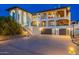 Exterior elevation of a home with a three car garage and desert landscaping at 1234 E Claire Dr, Phoenix, AZ 85022