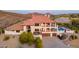 Lovely multi-story home with a Spanish-style tiled roof, multiple balconies, and a beautiful in-ground pool at 1234 E Claire Dr, Phoenix, AZ 85022