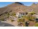 Expansive two-story home with desert landscaping, balconies, pool and captivating mountain views in the background at 1234 E Claire Dr, Phoenix, AZ 85022