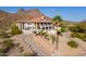 Majestic two-story home with a private driveway, mountain views, lush landscaping, and a terracotta tile roof at 1234 E Claire Dr, Phoenix, AZ 85022