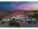 Stunning exterior view of home with multi-level balconies, sparkling pool, gorgeous mountain views, and desert landscaping at 1234 E Claire Dr, Phoenix, AZ 85022