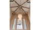 Elegant foyer featuring a statement chandelier and wood-paneled ceiling, complemented by abundant natural light from the windows at 1234 E Claire Dr, Phoenix, AZ 85022