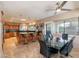 Spacious kitchen and dining area with an island, granite countertops, and ample natural light at 1234 E Claire Dr, Phoenix, AZ 85022