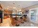 Spacious kitchen with custom wood cabinets, stainless appliances, and breakfast bar seating at 1234 E Claire Dr, Phoenix, AZ 85022