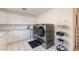 Well-equipped laundry area with modern washer and dryer set and abundant storage at 1234 E Claire Dr, Phoenix, AZ 85022