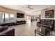 Inviting living area features media center, comfortable seating, and large windows, perfect for relaxation and entertainment at 1234 E Claire Dr, Phoenix, AZ 85022