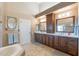 Spacious bathroom with double sink vanity, tile flooring, and custom lighting at 1234 E Claire Dr, Phoenix, AZ 85022