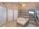 Bright main bathroom featuring a jetted tub, glass enclosed shower, and tile floors at 1234 E Claire Dr, Phoenix, AZ 85022