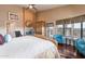 This main bedroom has a seating area, fireplace, ceiling fan, and exterior access at 1234 E Claire Dr, Phoenix, AZ 85022