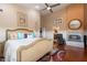 Open main bedroom with a fireplace, ceiling fan, ensuite bathroom, and stylish decor at 1234 E Claire Dr, Phoenix, AZ 85022