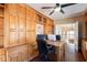 Spacious office with custom wood cabinets and desk, offering ample storage and workspace at 1234 E Claire Dr, Phoenix, AZ 85022