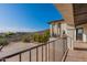 Backyard view with an outdoor living space including a patio with a stone floor and a scenic backdrop at 1234 E Claire Dr, Phoenix, AZ 85022