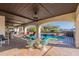 Picturesque backyard patio featuring an outdoor dining set, a pool, and scenic views of the surrounding landscape at 1234 E Claire Dr, Phoenix, AZ 85022