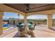 Inviting outdoor patio with stone floors, a view of the surrounding landscape, and a dining set at 1234 E Claire Dr, Phoenix, AZ 85022