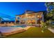 Back of a two-story home with a pool, a spiral staircase, and a lush green lawn at 1234 E Claire Dr, Phoenix, AZ 85022