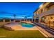 Pool with patio and a two-story home with outdoor seating at 1234 E Claire Dr, Phoenix, AZ 85022
