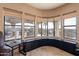 Captivating window view showcasing an outdoor pool, patio, and scenic desert landscape, enhancing the home's appeal at 1234 E Claire Dr, Phoenix, AZ 85022