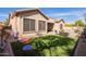 Backyard with artificial turf, patio, string lights, and an outdoor seating area at 13155 W Monterey Way, Litchfield Park, AZ 85340