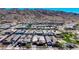 An aerial view of the property nestled in a scenic neighborhood with mountain views at 1341 E Paseo Way, Phoenix, AZ 85042