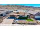 A contemporary single-Gathering home features manicured landscaping and mountain views at 1341 E Paseo Way, Phoenix, AZ 85042