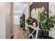 Hallway featuring wood flooring, stylish decor, and natural plants for a modern aesthetic at 1341 E Paseo Way, Phoenix, AZ 85042