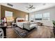 Bright main bedroom features hardwood floors, neutral walls, and a decorative ceiling fan at 1341 E Paseo Way, Phoenix, AZ 85042