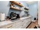 Organized pantry with ample counter space, storage and open shelving for easy access and functionality at 1341 E Paseo Way, Phoenix, AZ 85042