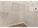 Spacious walk-in closet featuring wire shelving and wood-look floors at 14250 W Wigwam Blvd # 2111, Litchfield Park, AZ 85340