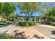 Lush community courtyard featuring mature trees and decorative pergola in a park-like setting at 14250 W Wigwam Blvd # 2111, Litchfield Park, AZ 85340