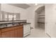 Well-lit kitchen with modern appliances and convenient access to the dining area at 14250 W Wigwam Blvd # 2111, Litchfield Park, AZ 85340
