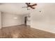 Large living room with dining area, wood-look floors, and neutral color scheme at 14250 W Wigwam Blvd # 2111, Litchfield Park, AZ 85340