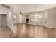 Bright living room with wood-look floors, neutral walls, and multiple windows at 14250 W Wigwam Blvd # 2111, Litchfield Park, AZ 85340