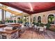 Outdoor community patio featuring a built-in grill and dining area under a shaded awning at 14250 W Wigwam Blvd # 2111, Litchfield Park, AZ 85340